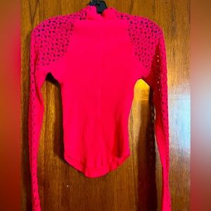 Pink crochet sleeved top with ribbed bodice.